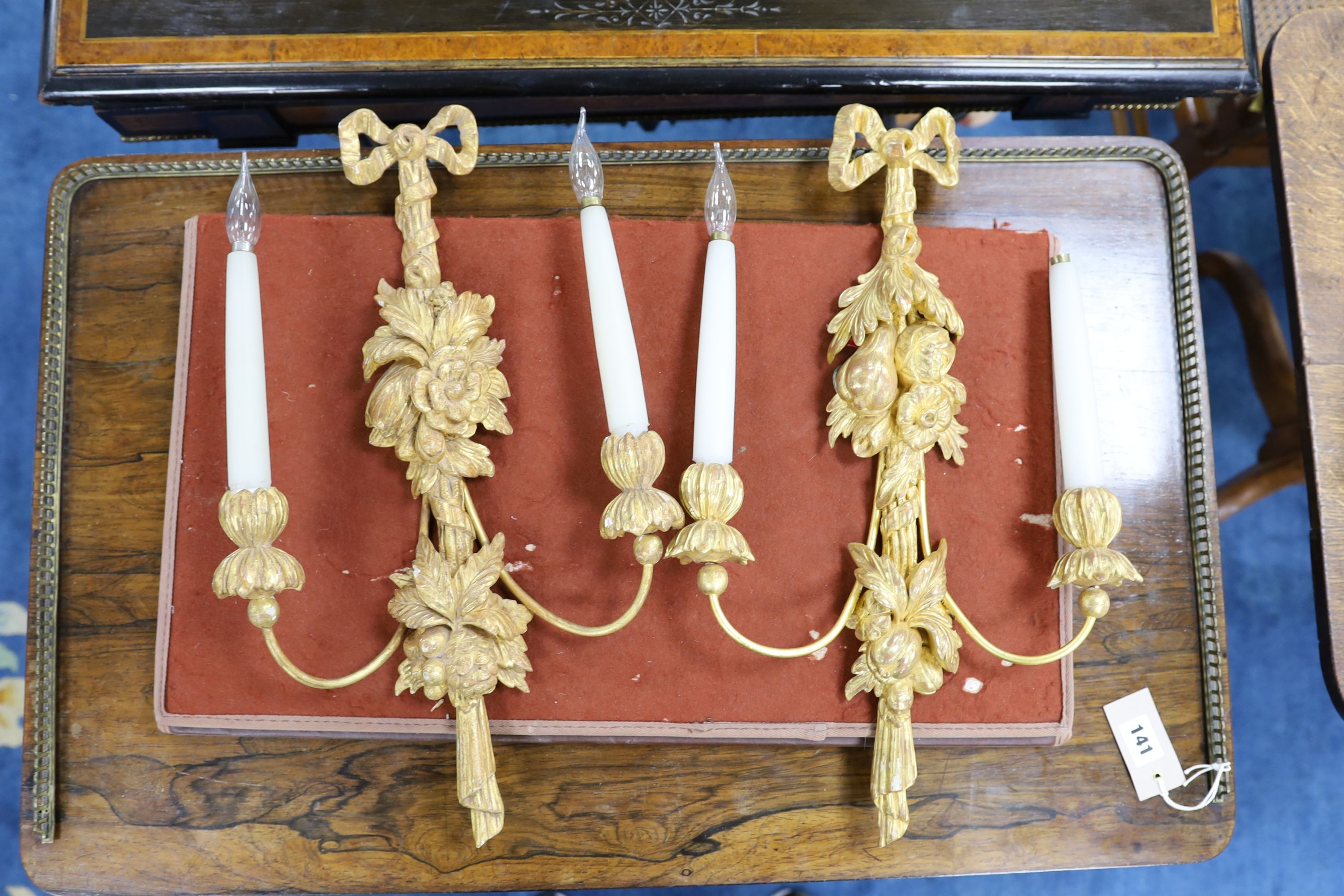 A set of 4 giltwood wall lights